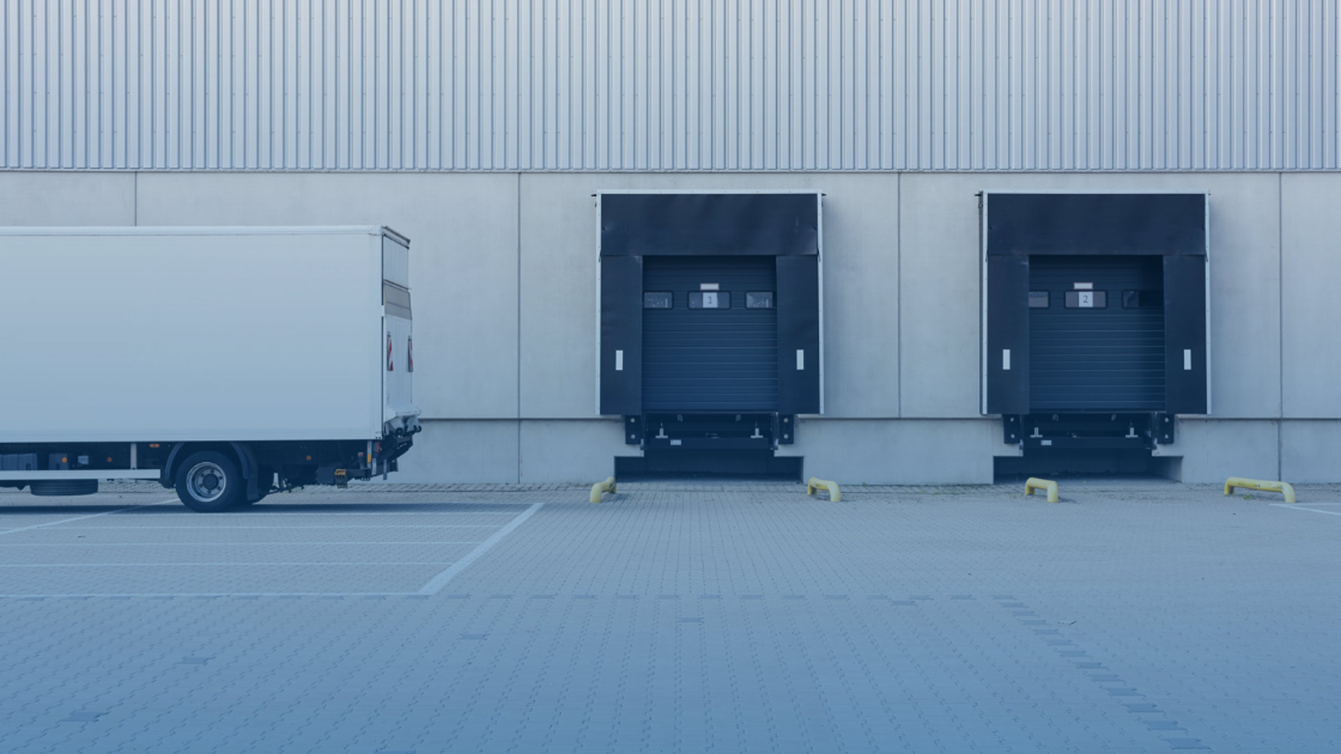 a row of trucks parked next to a building